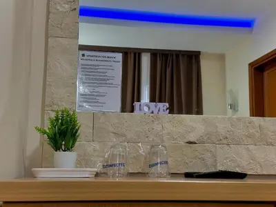 a counter with wine glasses and a mirror on it at 