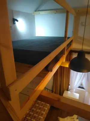 a bedroom with a bunk bed in a room at Rezervat in Jelašnica