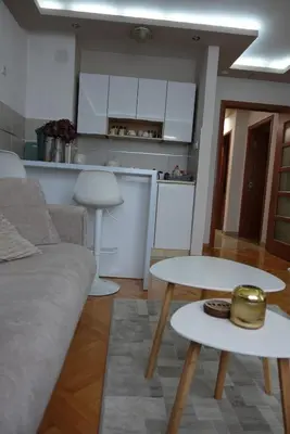 a living room with a couch and a table at Stan u centru Niša, Obilićev venac in Niš