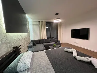 a living room with a bed and a couch at LiboroPlanet in Niš