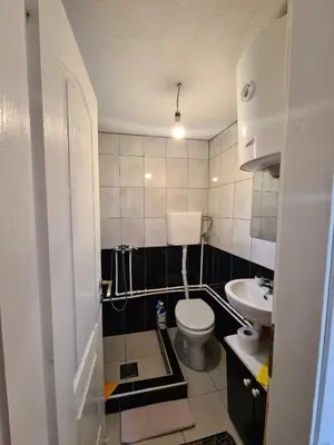 a small bathroom with a toilet and a sink at Goč Sunčani breg in Stanišinci