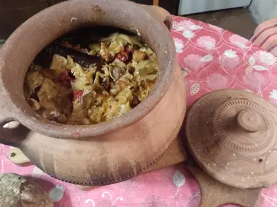 a pot of food sitting on top of a table at Seoska idila in Bela Palanka