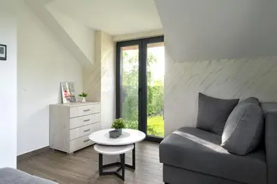 a living room with a couch and a table at Vision apartmani Goč in Goč