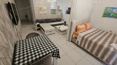 a view of a living room with a couch and a table at Kristal in Niš