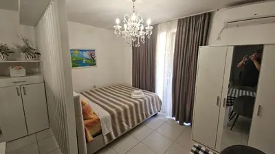 a person taking a picture of a room with a table at Kristal in Niš