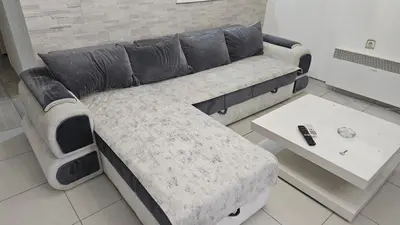 a living room with a couch and a table at Kristal in Niš