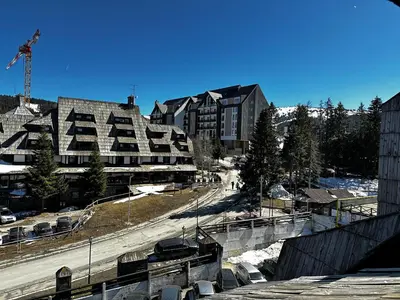 arial view of a city with buildings and a street at Konaci Kopaonik 28 in Kopaonik