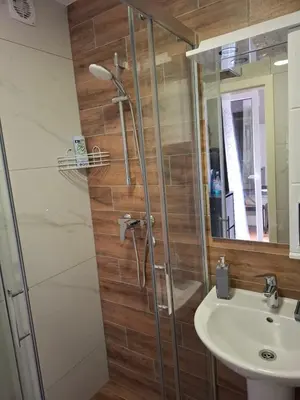 a bathroom with a shower and a sink at Apartman STAR Vrnjačka Banja in Vrnjci