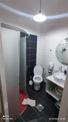 a bathroom with a toilet and a sink at Top rooms in Niš