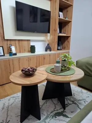 two tables in a living room with a tv at Apartman Biser Vranja - FREE PARKING - CITY CENTER in Vranje