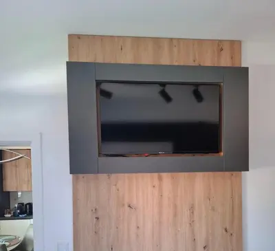 a flat screen tv on a wooden wall at Apartman Biser Vranja - FREE PARKING - CITY CENTER in Vranje