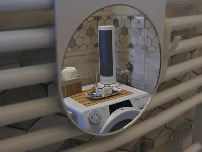 a mirror reflection of a radio in a wall at Apartman Biser Vranja - FREE PARKING - CITY CENTER in Vranje