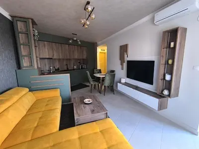 a living room with a couch and a table at Mina Lux in Paraćin