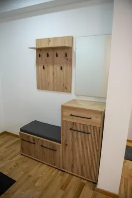 a room with a bench in the corner of a room at Apartman Tasic in Vranje