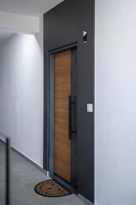 a hallway with a wooden door in a building at Apartman Tasic in Vranje