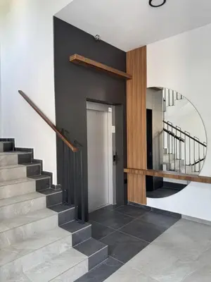 a staircase in a house with a mirror on the wall at Apartman Tasic in Vranje