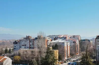 a view of a city with tall buildings at Planet Urban Apartment & SPA in Niš