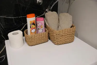 two baskets sitting on top of a white table at Apartment Story Nis in Niš