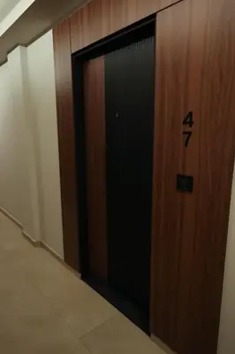 a elevator door with the number four on it at Apartment Story Nis in Niš
