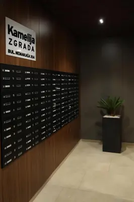a room with a wall of wine bottles at Apartment Story Nis in Niš
