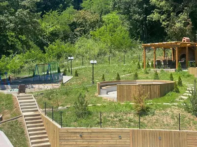 a skate park with a skateboard ramp and a playground at Sunshine Lux in Vrnjačka Banja