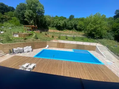a swimming pool on the roof of a house at Sunshine Lux in Vrnjačka Banja