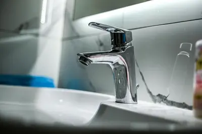a bathroom sink with a faucet on top of it at STAN na DAN MITIC FREE PARKING in Vranje