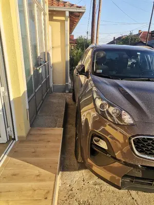 a car parked in front of a house at STAN na DAN MITIC FREE PARKING in Vranje