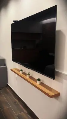 a large flat screen tv hanging on a wall at 