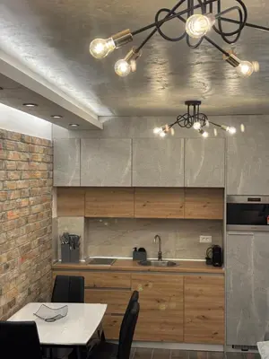 a kitchen with a table and a chandelier at 