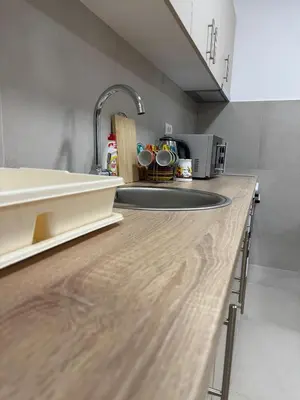 a kitchen with a sink and a counter top at Apartman CRYSTAL Vrnjačka Banja in Vrnjačka Banja
