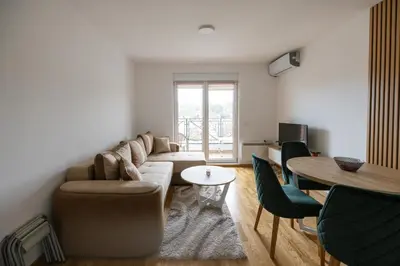 a living room with a couch and a table at Apartman STEFAN in Vrnjačka Banja