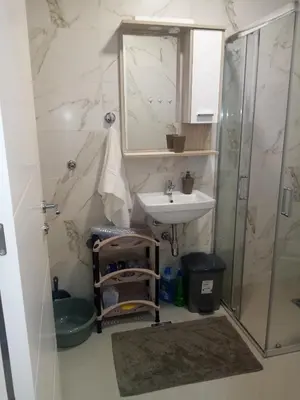 a bathroom with a sink and a shower at Moj kutak Sokobanja in Soko Banja