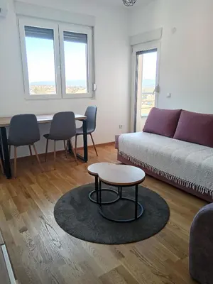 a living room with a couch and a table at Moj kutak Sokobanja in Soko Banja