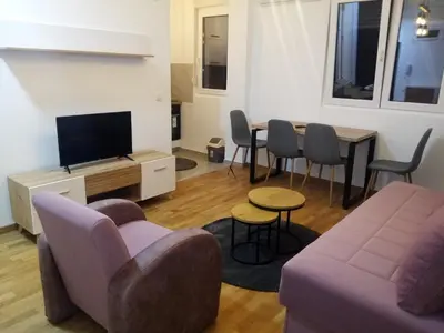 a living room with a couch and a table at Moj kutak Sokobanja in Soko Banja