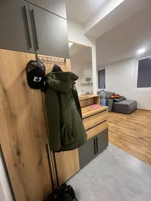 a jacket is hanging on the door of a kitchen at New Resort Treska, Kopaonik in Kopaonik