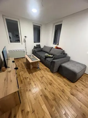 a living room with a couch and a table at New Resort Treska, Kopaonik in Kopaonik