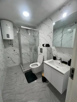a bathroom with a toilet and a sink and a shower at New Resort Treska, Kopaonik in Kopaonik