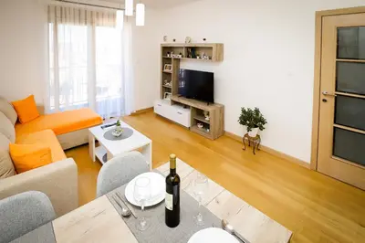 a living room with a couch and a table at Apartman NN in Vrnjci