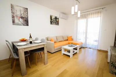 a living room with a couch and a table at Apartman NN in Vrnjci