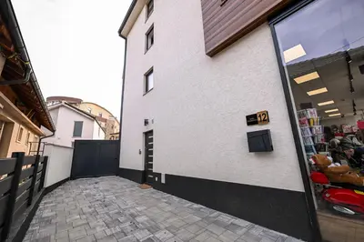 a building with a door on the side of it at Apartmani EMA SL in Vranje