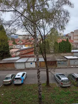 a group of cars parked in a parking lot at Apartman Klinički Centar Niš in Niš