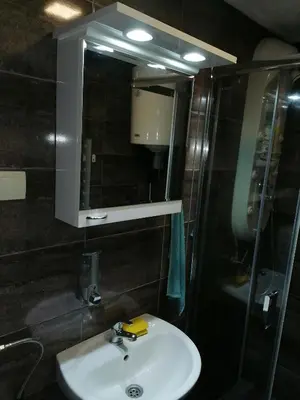 a bathroom with a sink and a mirror at Royal 019 in Vrnjačka Banja
