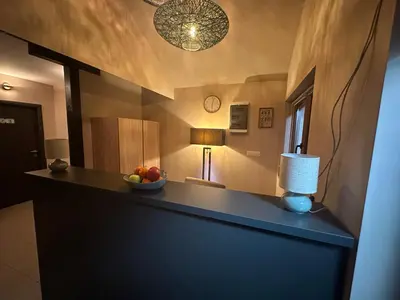 a room with a counter with a bowl of fruit on it at JP Motel Mali Pariz in Bor