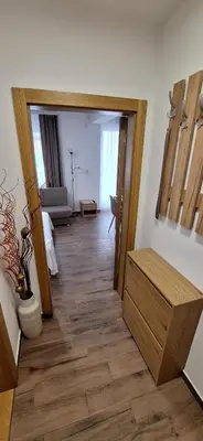 a room with a hallway with a wooden floor at Soko Bajka 1 in Soko Banja