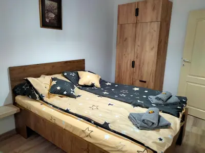a bedroom with a bed with stars on it at Apartman Nada in Jagodina