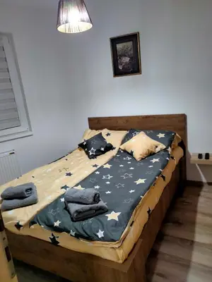a bedroom with a bed with stars on it at Apartman Nada in Jagodina