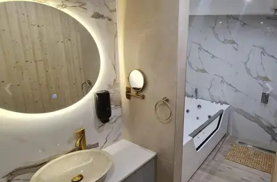 a bathroom with a sink and a mirror at Apartman La Casa and Spa in Vranje
