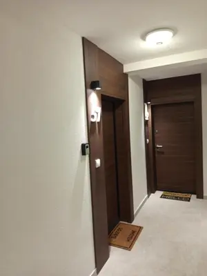 a hallway with a door with the number forty on it at Ramonda apartman sa bazenom, Vrnjačka Banja in Vrnjačka Banja