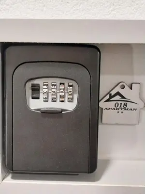 a remote control sitting on top of a shelf at Apartman 018 in Soko Banja